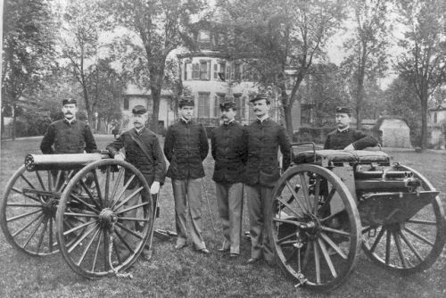 Officers of the US Marine Corps pose with a Gatling gun and Hotchkiss gun, c.1896