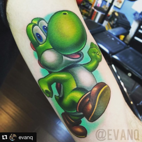 th-ink-inspiration:  Yoshi tattoo by Evan Q doing a guest spot @ Flesh Electric in San Antonio, TX.