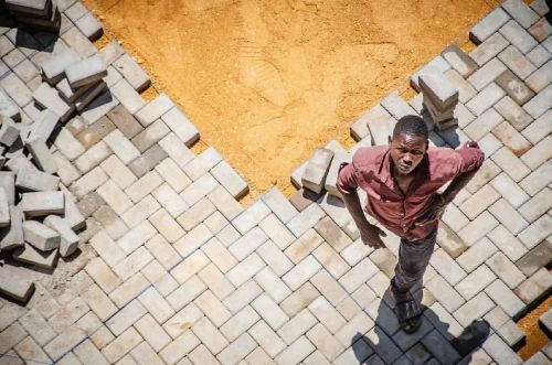 “Builders and Symmetry ” An aspect of human development.   Photo by : ©JOSHUA VICTOR SEM