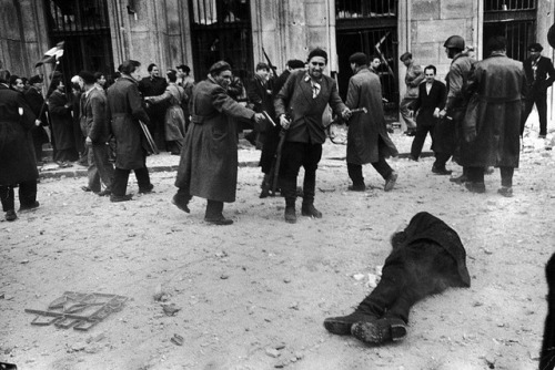 the-bogside-man:la-volpe-bianca:historicaltimes:Communist secret policeman shot by Hungarian rebels.