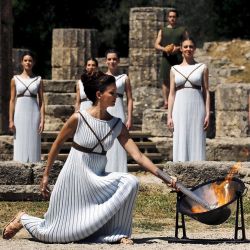 Proud to be Greek💪🏽 Repost @time ・・・ Greek actress Katerina Lehou, playing the role of High Priestess, lights a torch from the sun&rsquo;s rays reflected in a parabolic mirror during the dress rehearsal for the Olympic flame lighting ceremony