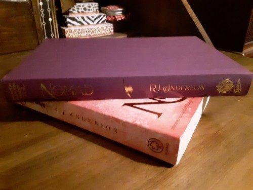 isfjmel-phleg:My new copy of @rj-anderson‘s Nomad looks beautiful beside the older edition! The purp