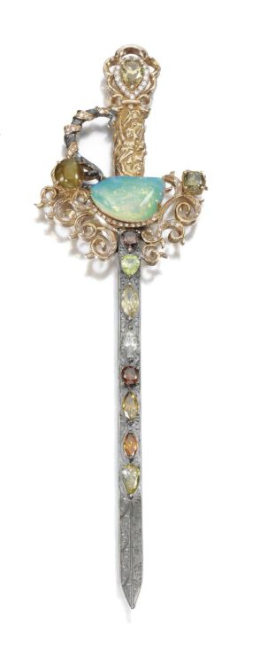 GEM-SET AND DIAMOND BROOCH Designed as a sword set with a half-moon shaped opal, cat’s-eye chr