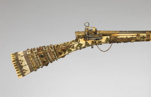 An Turkish miquelet musket decorated with gold, ivory, brass, mother of pearl, and jewels.  Late 18t