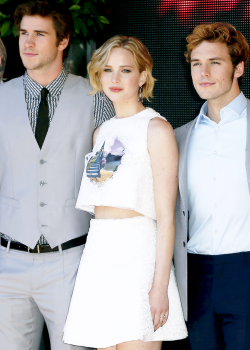 jenniferlawrencedaily:  Jennifer Lawrence, Liam Hemsworth and Sam Claflin attend  the Mockinjay Part 1 party at Cannes Film Festival, France on May 17, 2014 