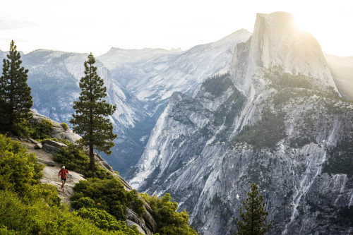 When landscapes speak for themselves.Here a runner is greeted by the sun rising over Half Dome in Yo