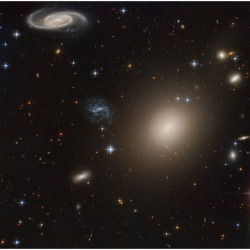 Galaxies Away   Image Credit &amp; Copyright: Data - Hubble Legacy Archive, Processing - Domingo Pestana  Explanation: This stunning group of galaxies is far, far away, about 450 million light-years from planet Earth and cataloged as galaxy cluster Abell