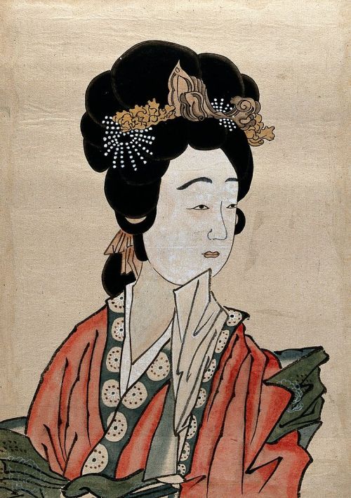 A Japanese lady in traditional dress including hair ornaments, a kimono and a whitened face, 19th Ce