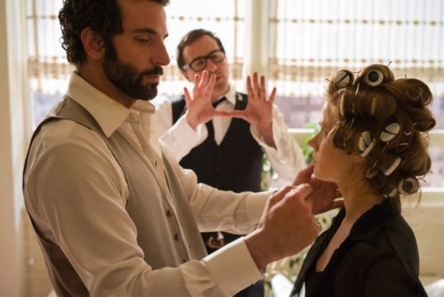 David O. Russell on the set of American Hustle with Bradley Cooper and Amy Adams.