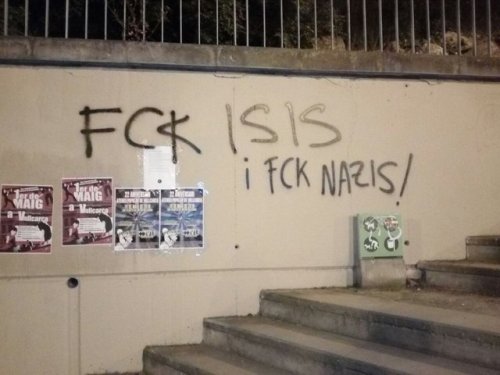Antifascists fix up some nazi graffiti in Vallcarca, Barcelona