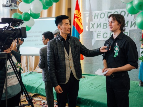 Ben being interviewed by a local TV station at a tree planting celebration