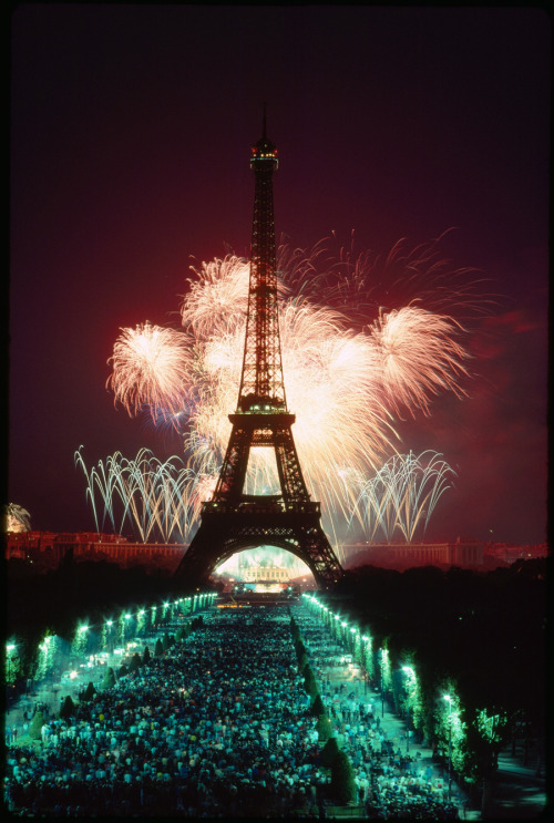 A fireworks display illuminates the Eiffel Tower.This photograph appeared on the cover of the July 1