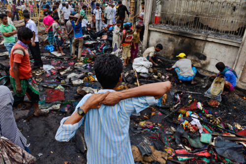 Ismail Ferdous/AP Photo Bangladeshis searched for their belongings after clashes during a protest in