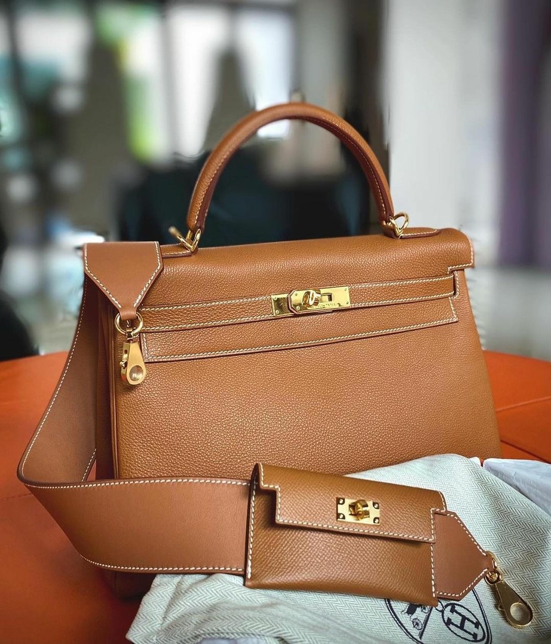 SLFMag — Hermes Kelly bag with matching strap featuring a