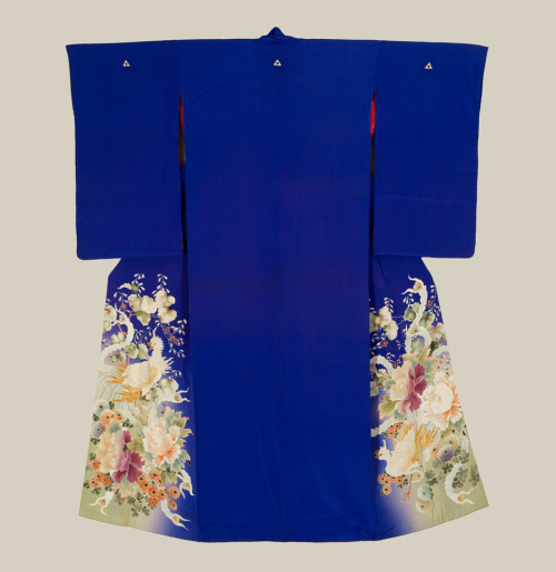 A refined blue kinsha-silk irotomesode featuring yuzen-dyed phoenix and flower patterns with hand-pa