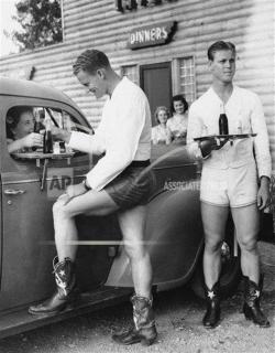 vintageeveryday:  In the 1940s, men dressed in short shorts and cowboy boots served up women at a drive through in Dallas.