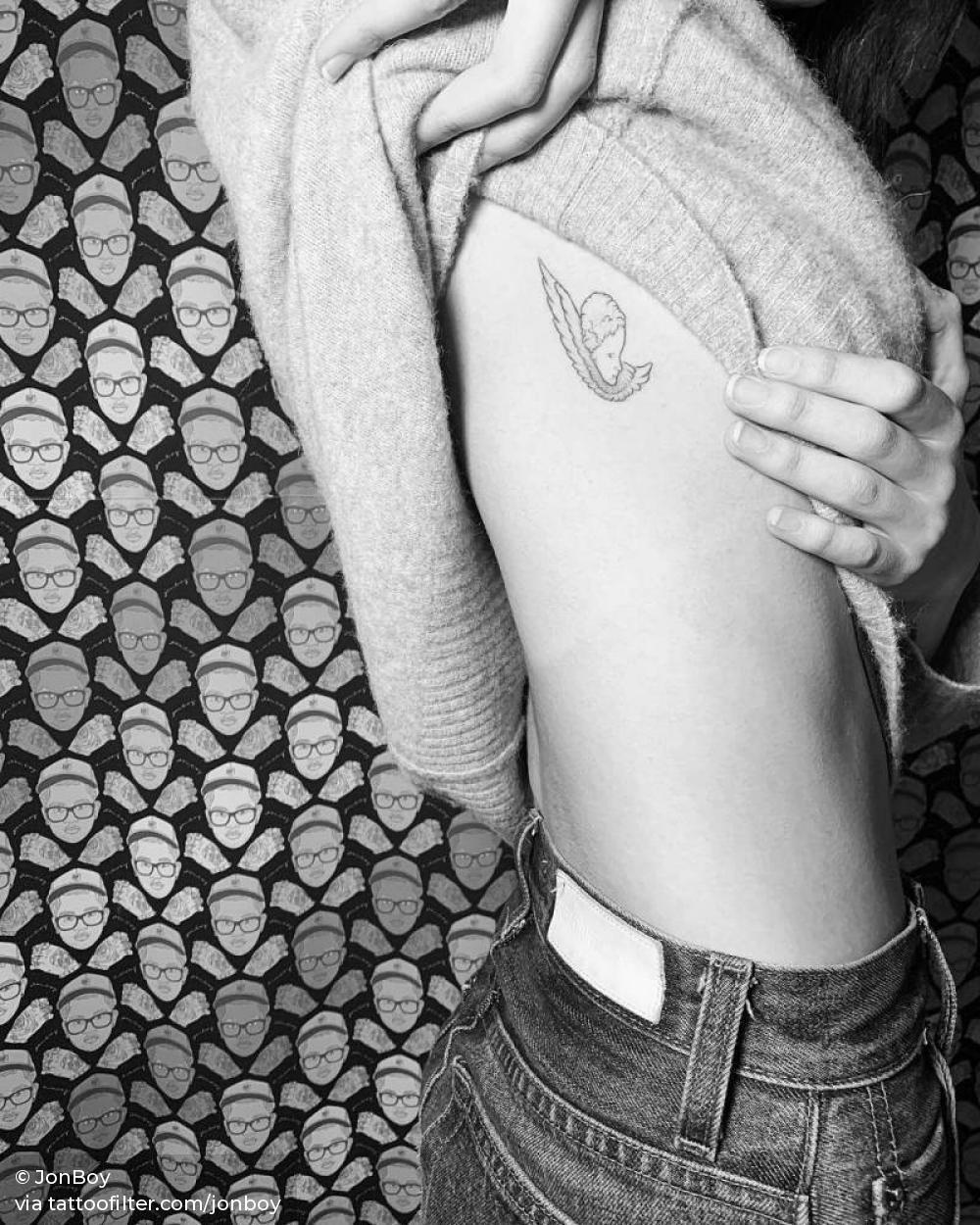 Picassos Le Visage de la Paix tattoo on Kaia Gerber