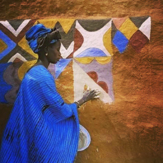 A Soninke woman paints the wall of her house in Djajibine, Mauritania
Photo by Margaret Courtney-Clarke﻿