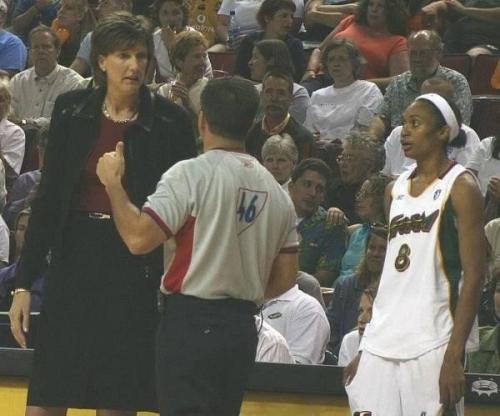 203 cm tall Anne Donovan. It looks like the referee is short before to receive a face slap from the 