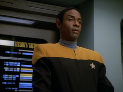 A Conversation On The Bridge Between Janeway, Tom, Chakotay And Tuvok. Tuvok Makes A Comment About Human