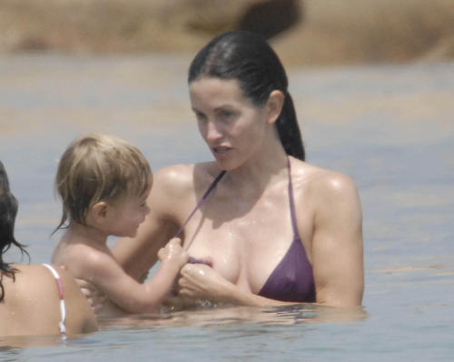 toplessbeachcelebs:  Courtney Cox (Actress) bikini nipple slip in Sardinia, Italy (June 2006)