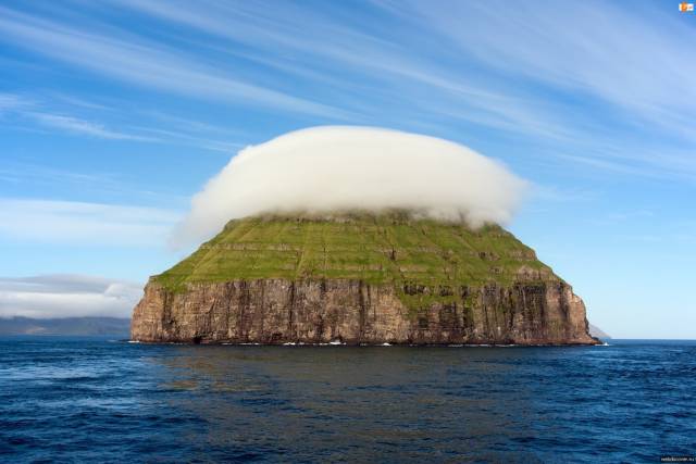 This is a photo of the small island of Litla Dimun which is situated between Suouroy and Stora Dimun in the Faroe Islands. It is...