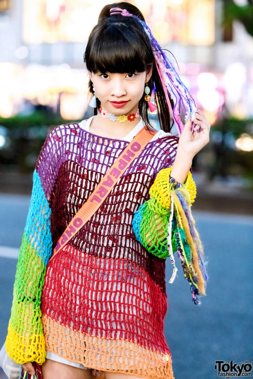 15-year-old Japanese student Yoh on the street in Harajuku wearing a colorful look with a vintage kn