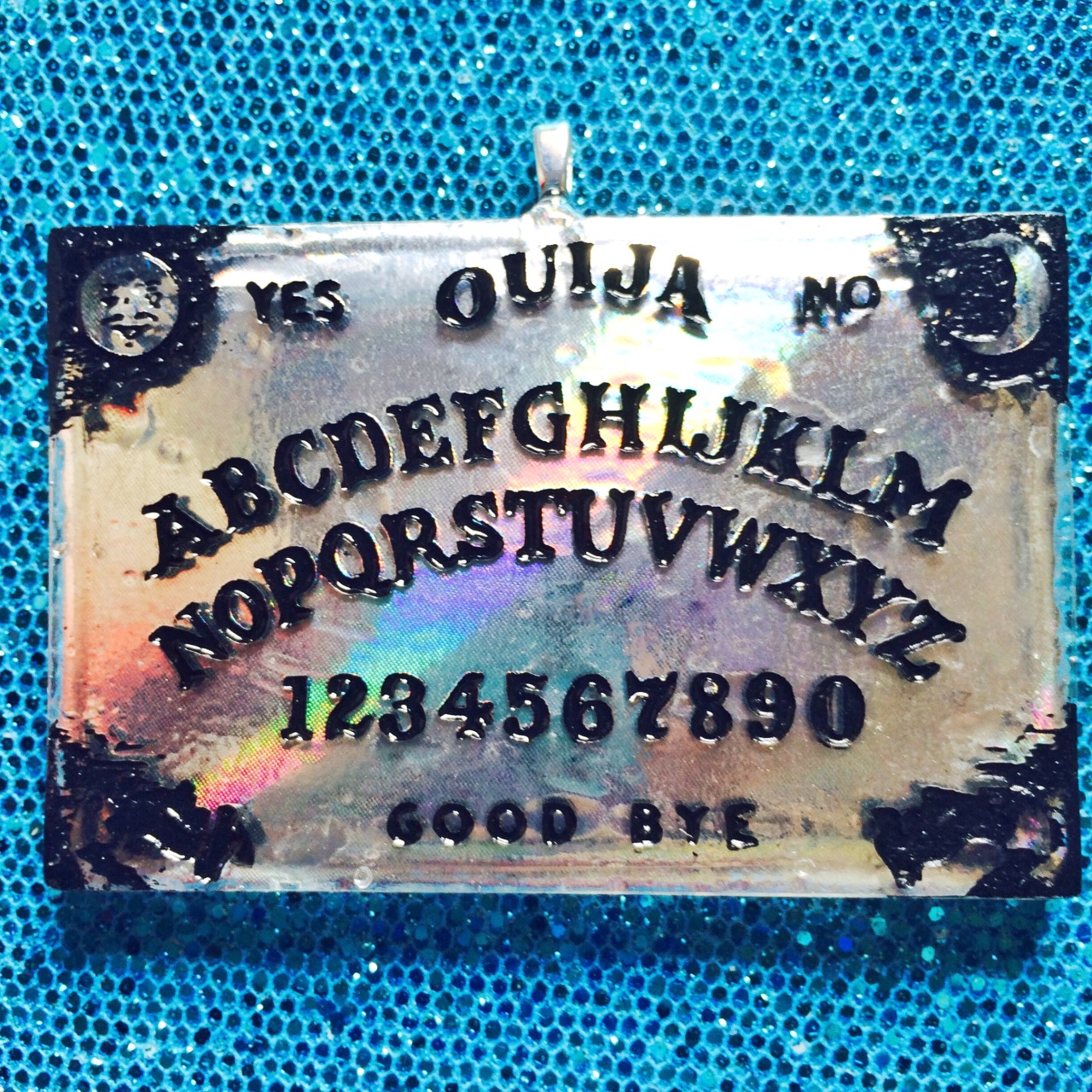 jinxandcurses:  NEW! Holographic ouija boards in planchettes in pink, purple, blue,
