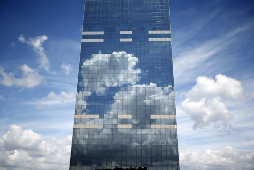 Clouds are reflected in the Midi Tower in downtown Brussels on June 21, 2015. (Charles Platiau/Reute