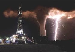 cshibby:  ba614:  THIS IS A PICTURE THAT SOMEONE TOOK WHO WORKS ON AN OIL RIG IN TEXAS.HE WANTED TO GET A SHOT OF THE LIGHTNING THAT WAS FLASHING BY. HE WAS UNAWARE OF THE TORNADO UNTIL THE LIGHTNING ILLUMINATED IT.This has been called a one-in-a-million