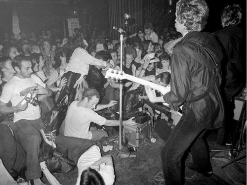 Lizzy Mercier Descloux and Didier Esteban photographed by Richard Young at a Sex Pistols gig, 100 Cl