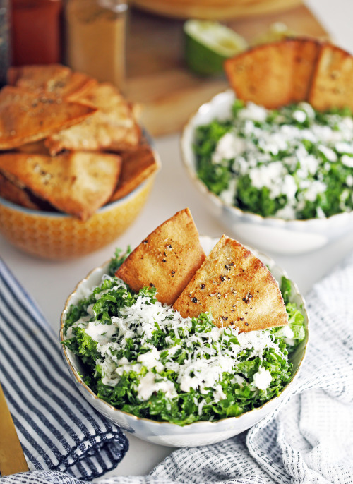 PARMESAN KALE SALAD WITH GARLIC LIME DRESSING AND PITA CHIPS - Quick homemade pita chips are the per