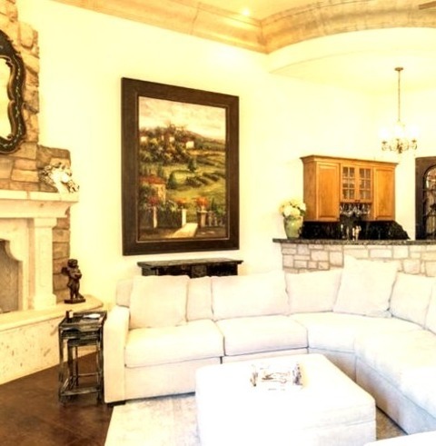 Home Bar - Living RoomMid-sized Mediterranean Enclosed Living Room Idea With A Bar, White Walls, A Brick