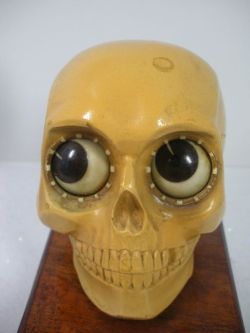 frankensteinsfunhouse:@DrLindseyFitz: Oswald Rotating Eye Skull Clock from the 1920s, made in West Germany. The eyes rotate to tell the time.