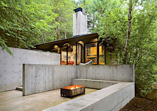 archatlas:    Tye River Cabin Olson KundigSituated in a dense forest near the Tye River, this meditative retreat connects to the nature that surrounds it.The square base of the two-level structure is rendered in cast-in-place concrete, as is the large