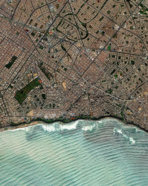 dailyoverview: Waves roll into the shores of Lima, Peru. The Miraflores neighborhood, seen here, is 