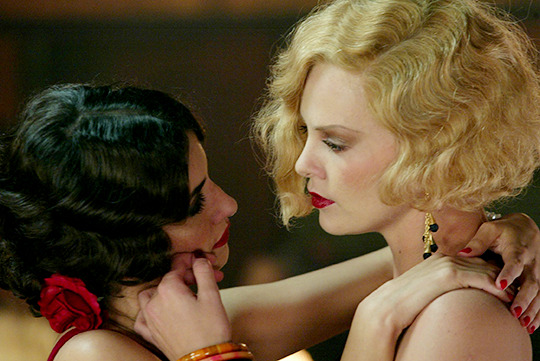 therondaily:  Charlize Theron and Penélope Cruz in Head in The Clouds, 2004.