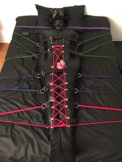 feelingknottycda:  One locked @hushpuppy1980, hushed up properly by a gag under his puppy hood, clearly enjoying his sleepsack time, judging by how his cock is straining in that cage.