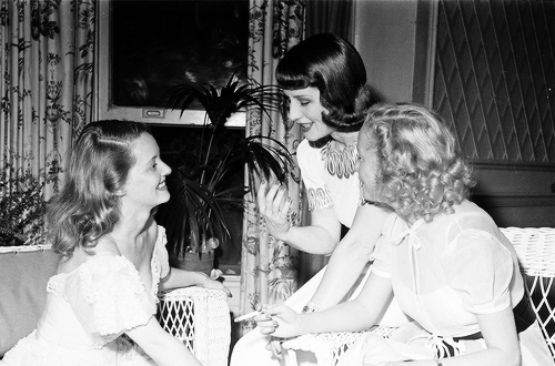 wehadfacesthen:  Bette Davis hosts The Tailwaggers Party to benefit stray dogs, with