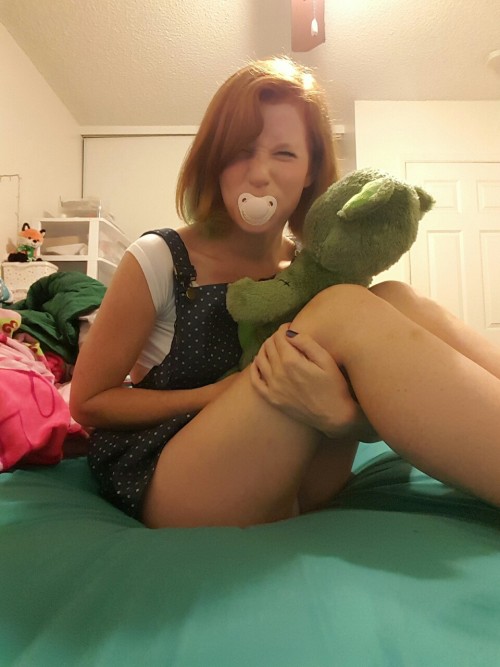 foxylittlepirate:  Just a little bit little today.  Loving my new paci from @onesiesdownunder! I cant wait to get a onesie from them! If you look, you can see Daddy playing a game on skype while I color ^.^ @darrddy 