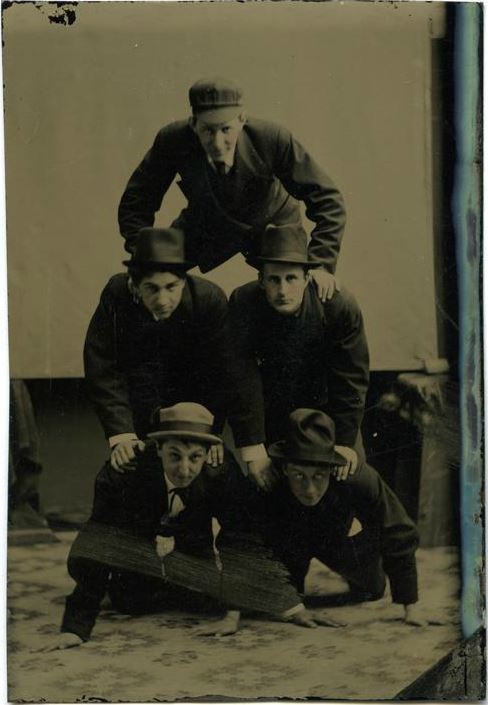 ca. 1870-80s, [tintype portrait of Horace R. Patten, bottom left, and four students forming a human 