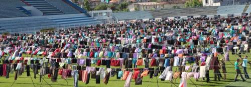 ilirpelasgian: nyctogbg: Thousands of women’s dresses collected then hung across the field of Prisht