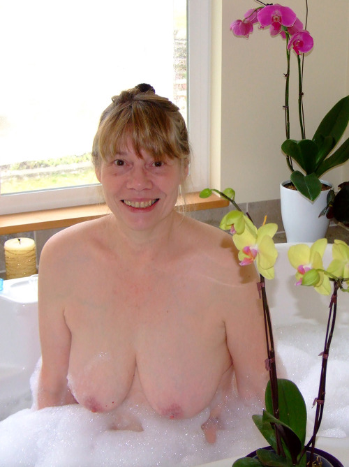 Porn photo Admiring Lady Reba, boob-deep in warm bubbles…