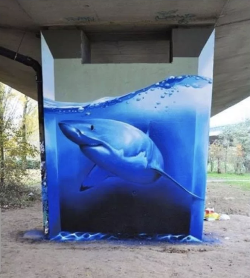 sober-midnights: sixpenceee: Detailed shark and water on concrete pillar. The artist is Smates Imagi