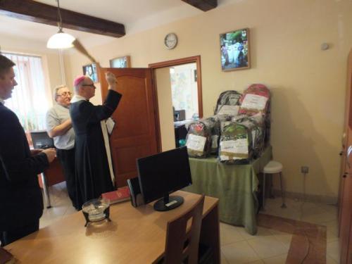 Polish priest blessing backpacks for a charity event. Włocławek, 2014.