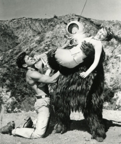 Claudia Barrett and a shirtless, hunky George Nader in Robot Monster (1953).  