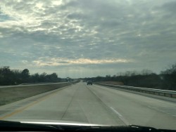 I just love the way the sun shines through the clouds like that  On Route 69 in Oklahoma heading south just outside Crowder