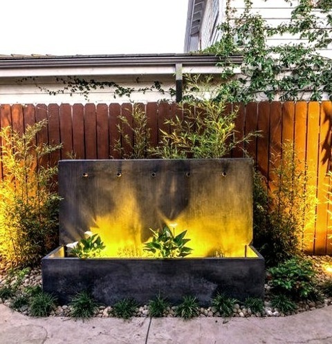 Fountain - LandscapeSummertime Photo Of A Medium-sized, Drought-tolerant, Contemporary Backyard Gravel