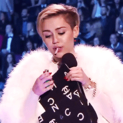  Miley Cyrus smoking a joint while receiving an award at the EMAs   