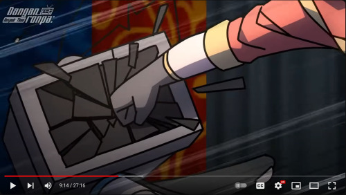 A screenshot from DRDT Chapter 2 Episode 16, portraying an animation frame. Ace's gloved hand sweeps in from the right to punch MonoTV in the face. The screen shatters, going gray.